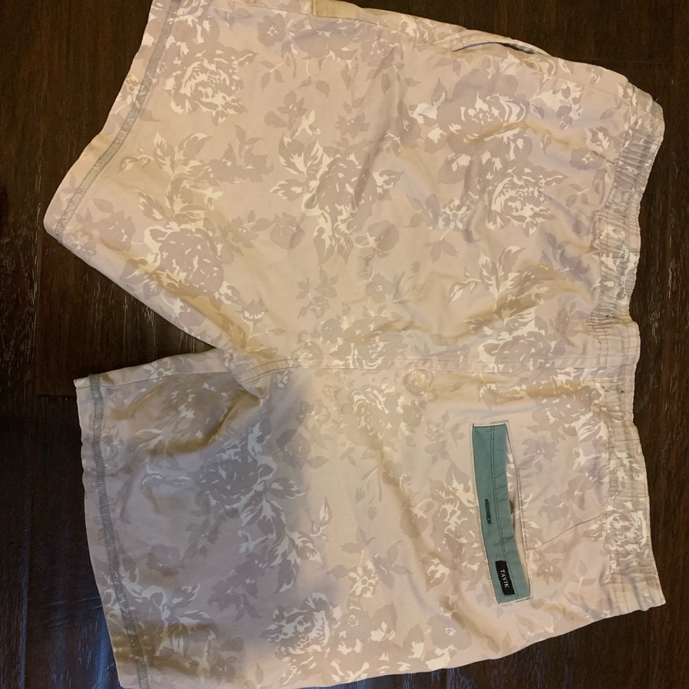 Tavik shorts. size small. beige and blue detail